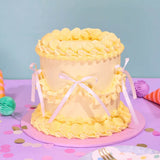 Vintage Cake - Single Colour with Swiss Meringue icing, six layers, delicate ribbon accents by Crumbs & Doilies.